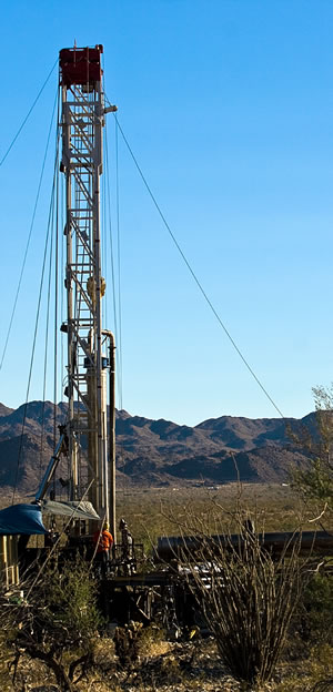 photo vista with well-drilling rig in foreground